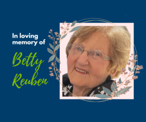 Title slide of In memory of Betty Reuben with a picture of Betty smiling.
